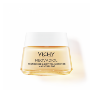 Vichy Neovadiol Nachtpflege in einem runden, gläsernen Tiegel mit einem weißen Deckel und orangefarbenem Inhalt.