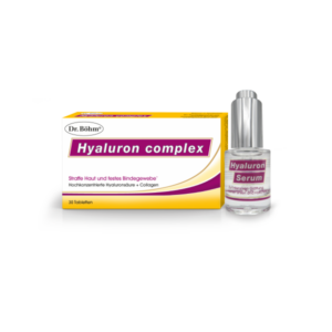 Verpackung von Dr. Böhm Hyaluron complex mit gelben Details und daneben eine Flasche Hyaluron Serum in transparentem Design.