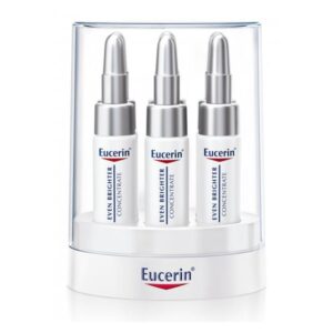 Drei Fläschchen mit Eucerin Even Brighter Konzentrat in einer durchsichtigen Verpackung.