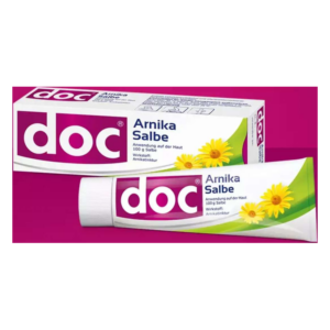 Arnika-Salbe in einer Tube mit gelben Blüten auf dem Etikett, verpackt in einer Kartonage mit lila Schriftzug.