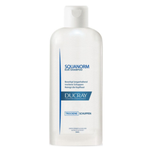 Flasche Ducray Squanorm Kur-Shampoo mit Weißer Verpackung und blauen Schriftzügen für die Behandlung trockener Schuppen.