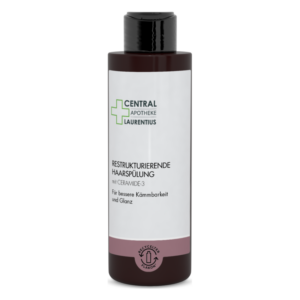 Flasche mit restrukturierender Haarspülung, enthält Ceramid-3, für bessere Kämmbarkeit und Glanz.