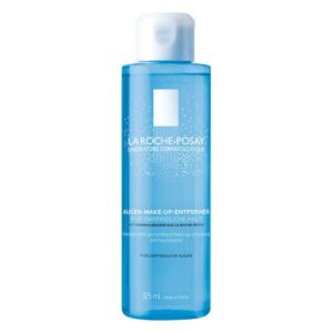 Durchsichtiger blauer Augen-Make-up-Entferner in einer Plastikflasche mit Spender und pH-neutraler Formel für empfindliche Haut.