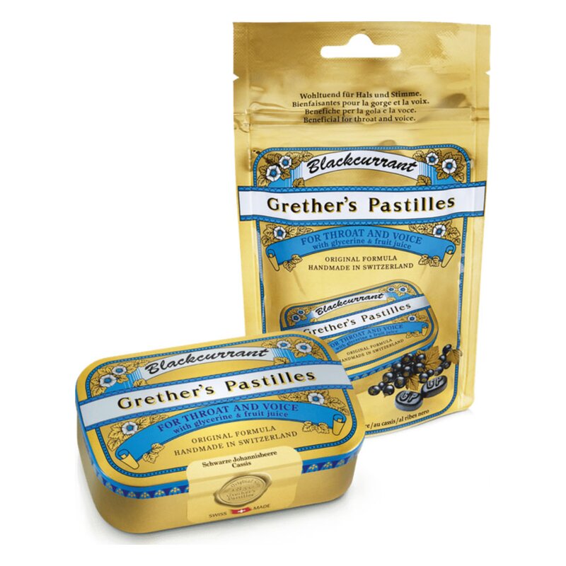Packungen von Grether's Pastillen mit schwarzer Johannisbeere, eine in einer Dose und eine in einer Tüte.