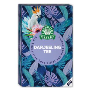 Verpackung von Darjeeling Tee mit buntem Pflanzenmuster und einer Abbildung einescockatoos auf der Vorderseite.