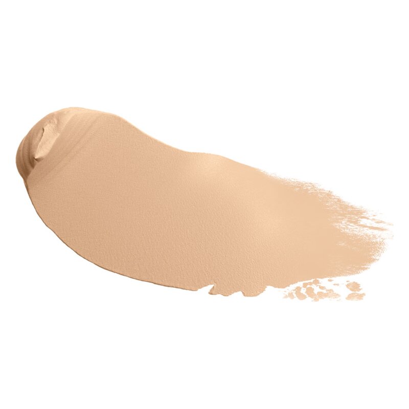 Ein cremiger Make-up-Farbton in einem warmen Beigeton, der teilweise auf einer glatten Oberfläche verteilt ist.